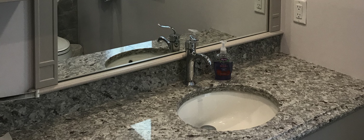 Custom bathroom mirror, trimmed to countertop